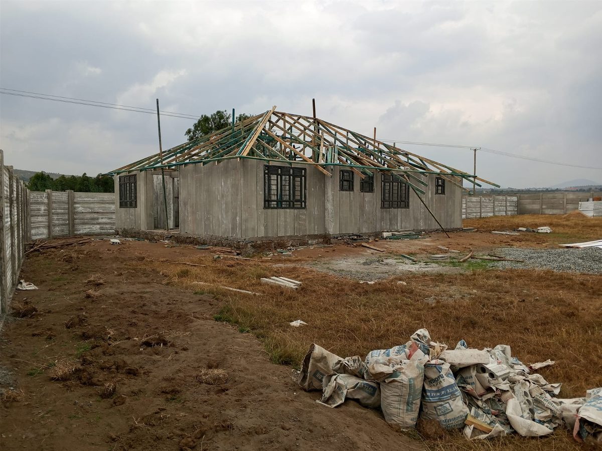 Madao Roofing Solutions crew installing roof trusses on site