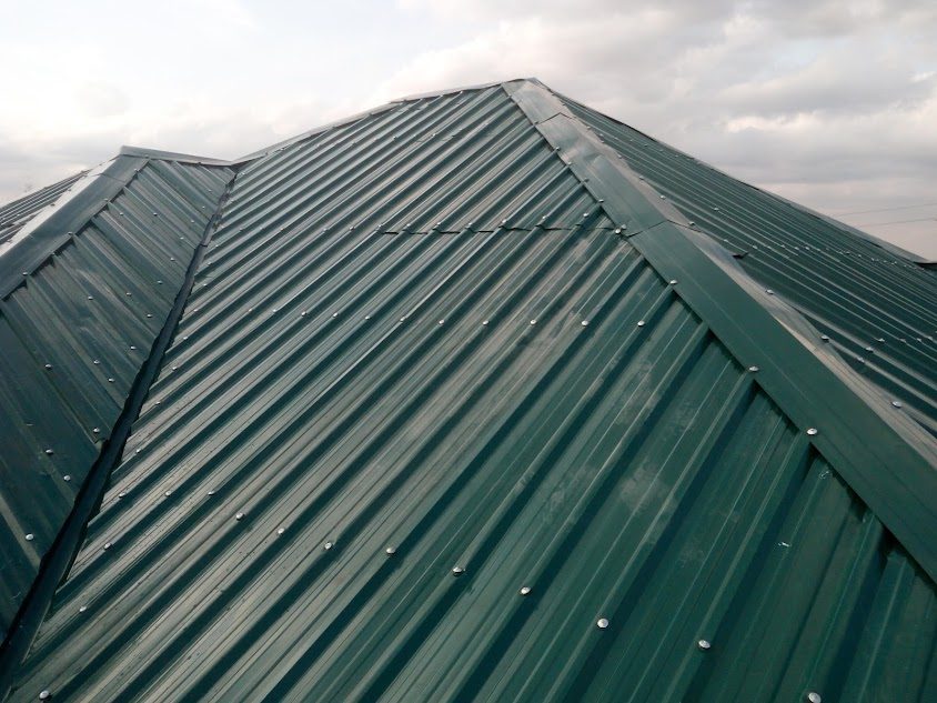 Completed dark green corrugated hip roof, close up