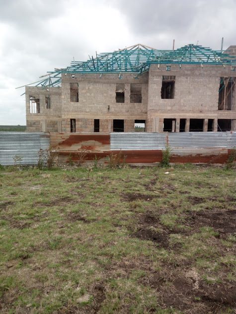 Two-storey home with roof trusses under construction